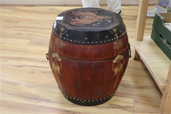 A Chinese red and black lacquer barrel shaped container